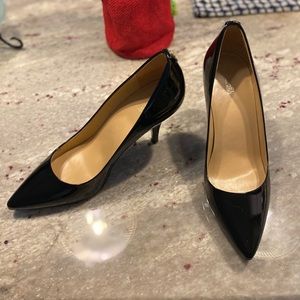 Michael Michael Kors black patent leather pumps.